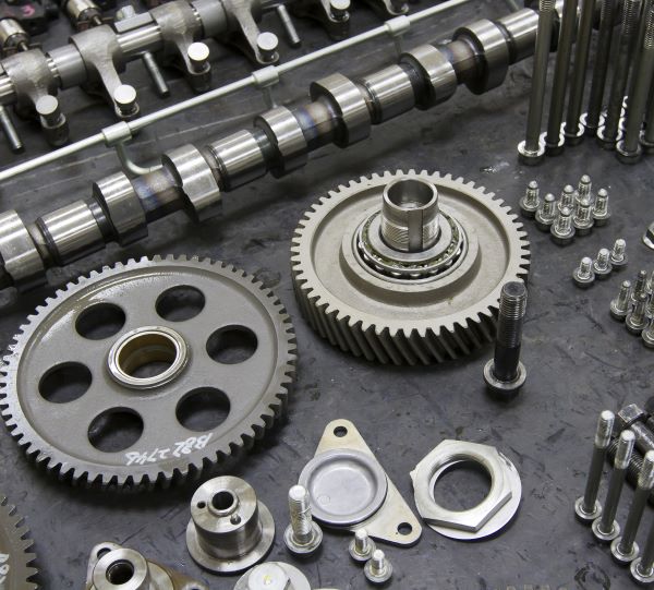 Precision mechanical assembly with gears, shafts, bearings, and CNC machined metal components