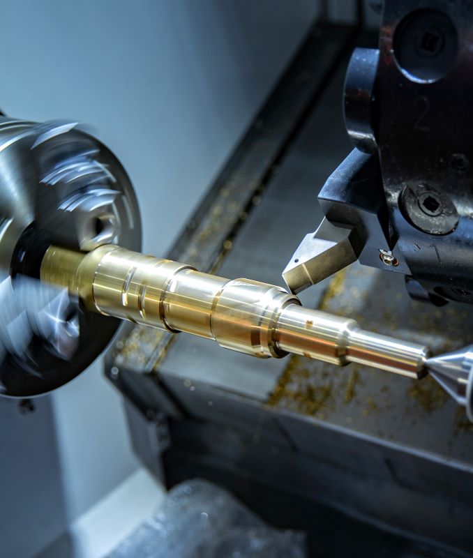 CNC turning process machining a precision metal shaft with tight tolerances and excellent surface finish