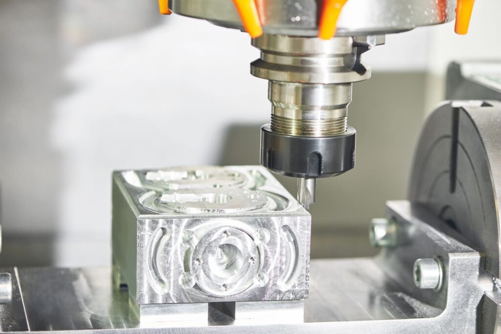 Precision CNC milling process machining an aluminum component on a CNC machining center