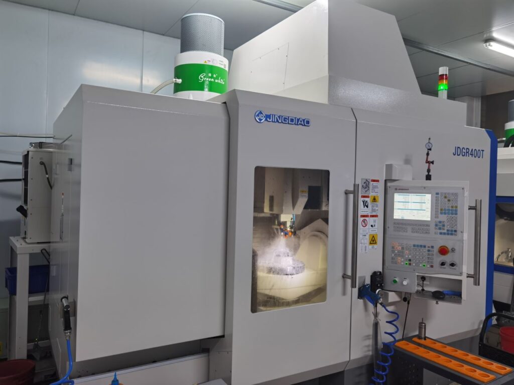 5-axis CNC machining center producing precision metal parts