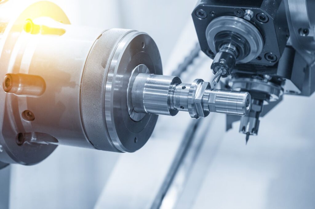 High precision CNC machining center producing custom metal components in a modern manufacturing workshop