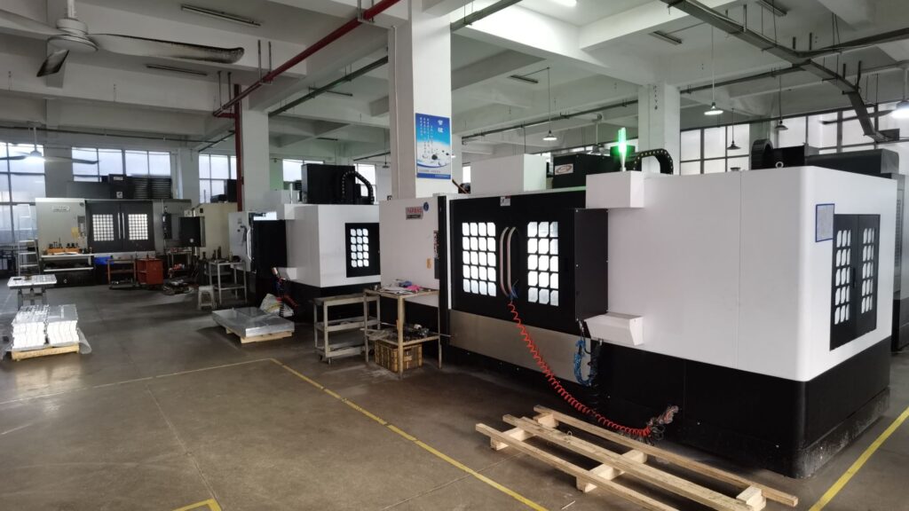 Modern CNC machining facility with multiple precision machining centers and organized production layout
