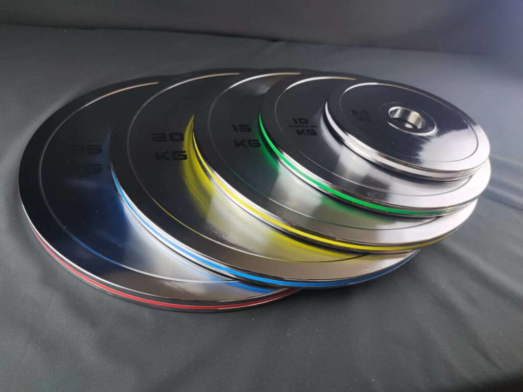 Precision machined steel weight plates with polished chrome plating and colored edge design