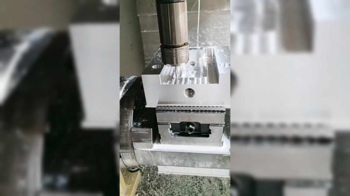 End mill cutting aluminum part during CNC milling process