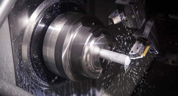 CNC turning process machining a metal shaft on a lathe