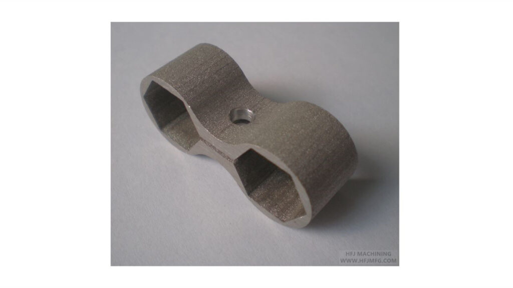 Precision metal part with sharp internal corners produced by EDM machining